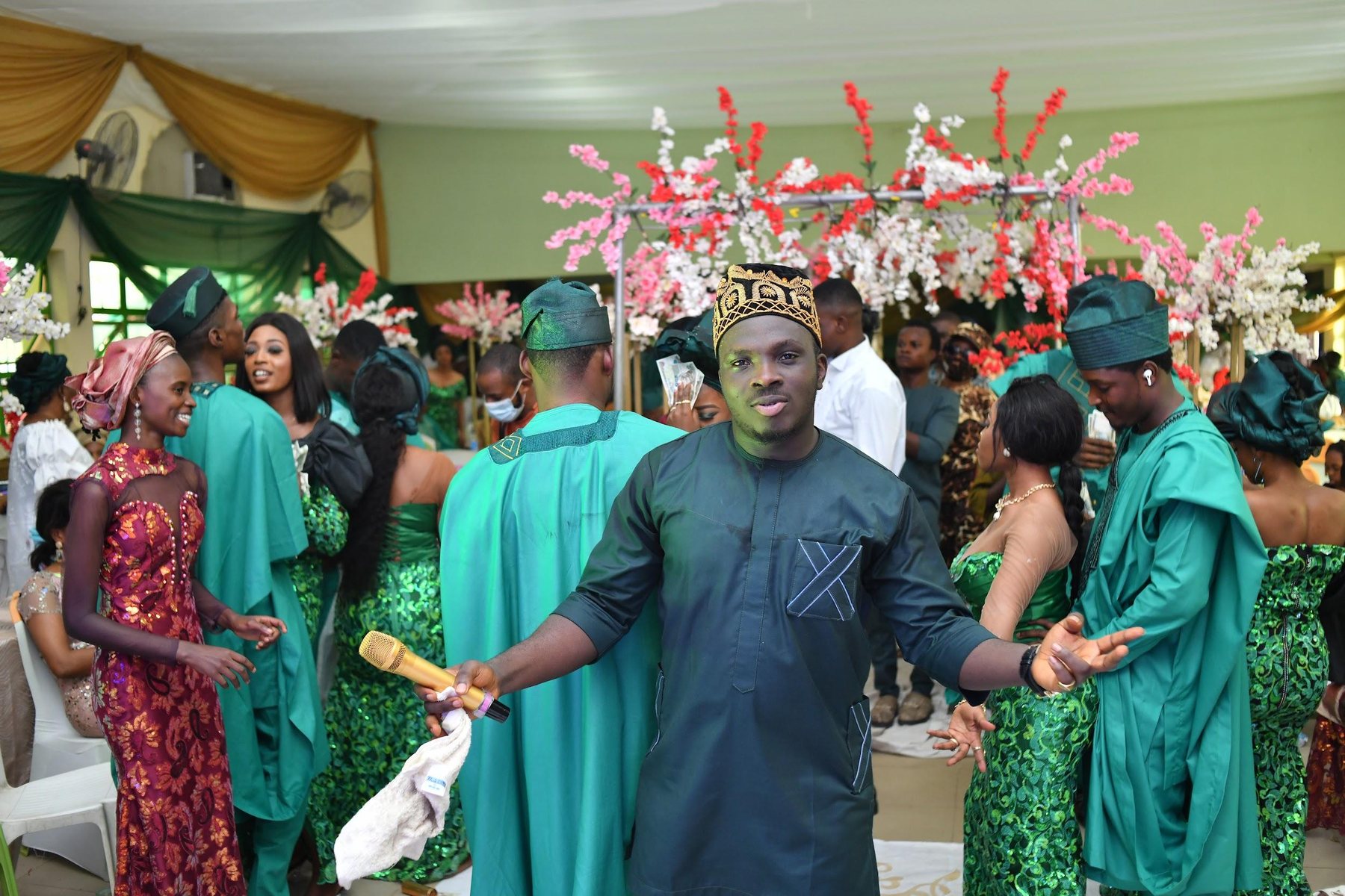MC Crown facilitating audience participation at a cultural event